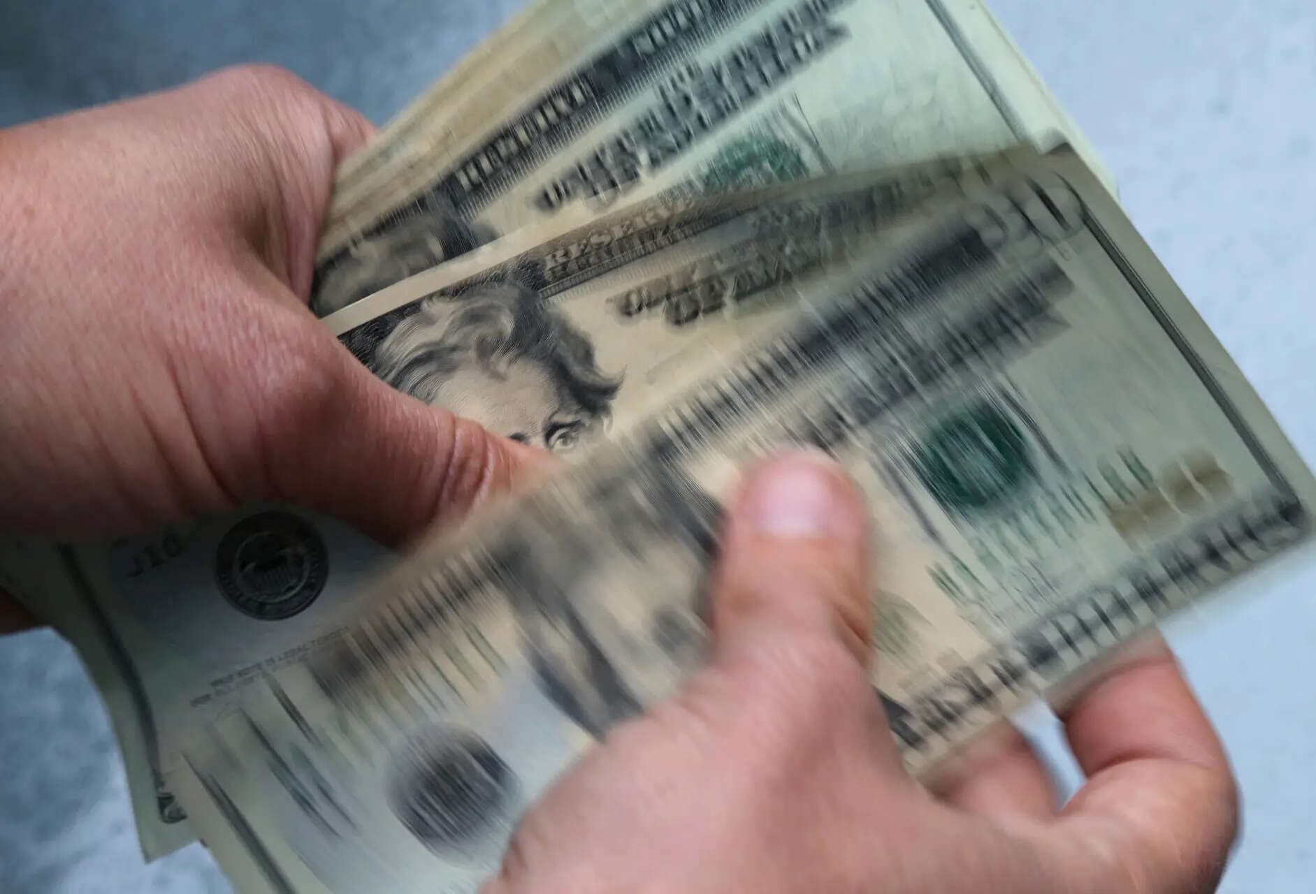 Dollar heads for weekly loss as Fed hike bets fade, AI jitters linger