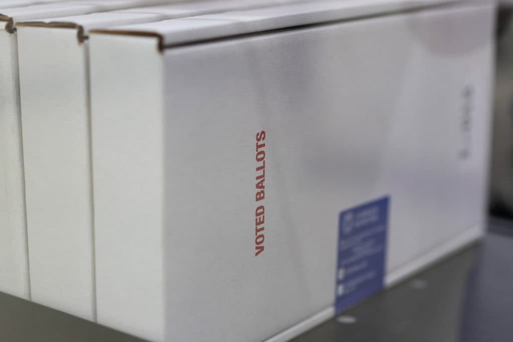 Federal judge extends block on Trump order seeking to limit mail voting in the midterms