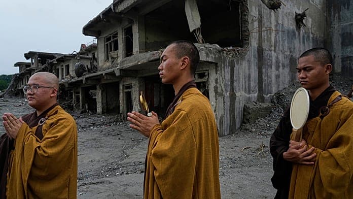 Nepal holds a day of mourning and rescue efforts continue after flash floods kill 1,300