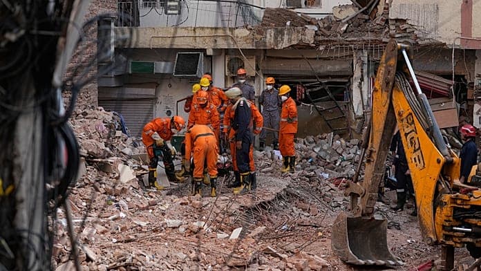 Rescuers search rubble for survivors after New Delhi hostel collapse kills seven