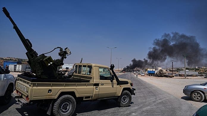 Temporary wartime weapons depot explosion kills 14 outside Syria's Idlib