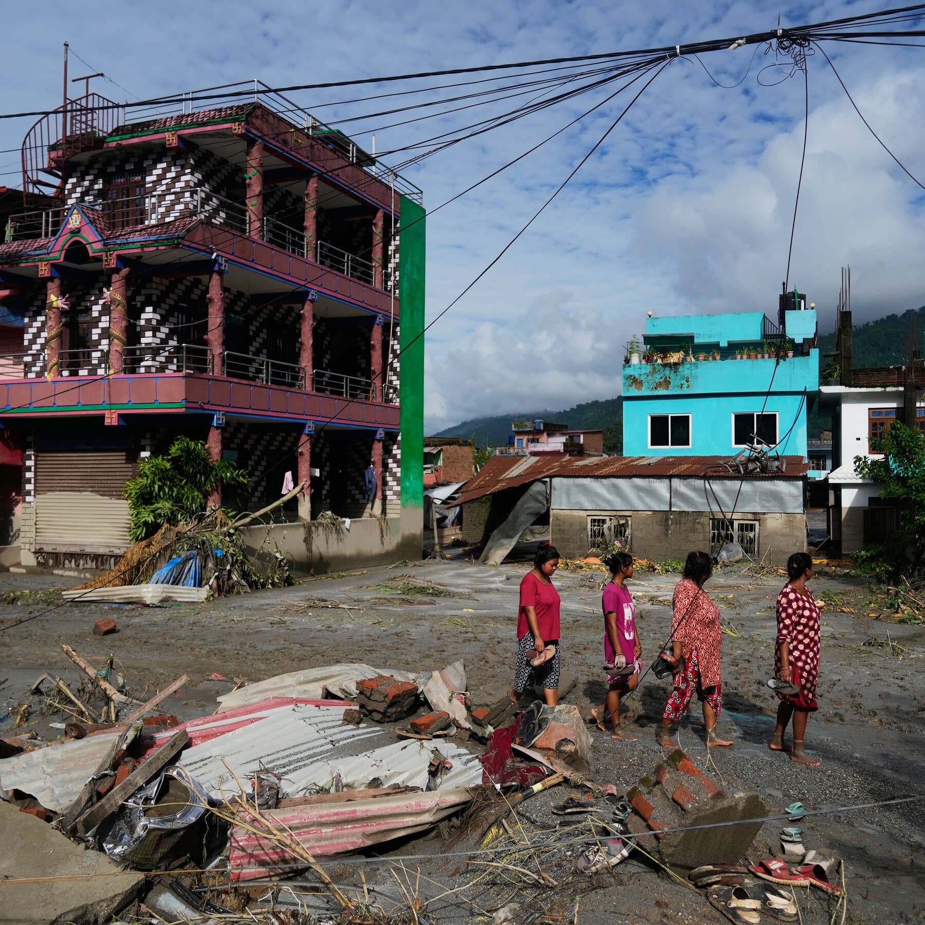 Live Updates: Rescuers Search for Missing and Stranded Under Threat of More Floods